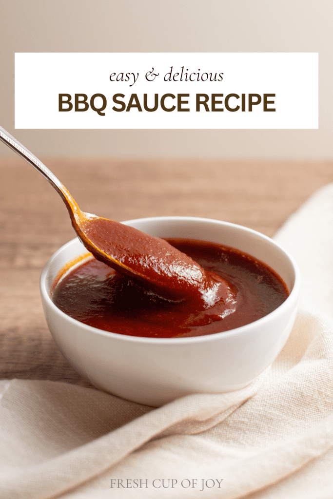 photo of a spoon dipping in a bowl of bbq sauce