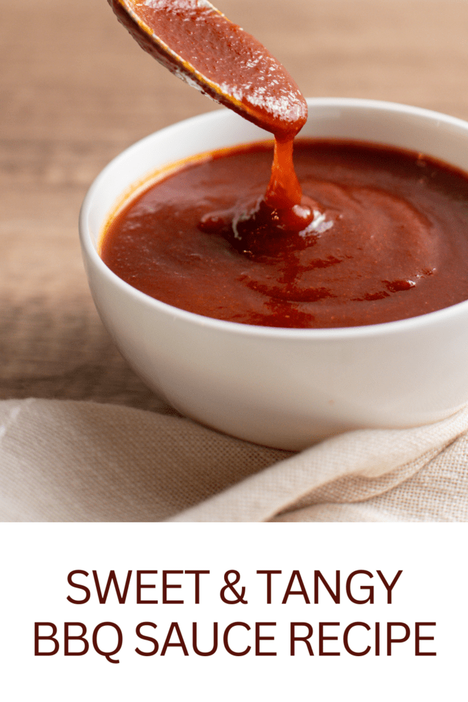 photo of a spoon dipping in a bowl of bbq sauce