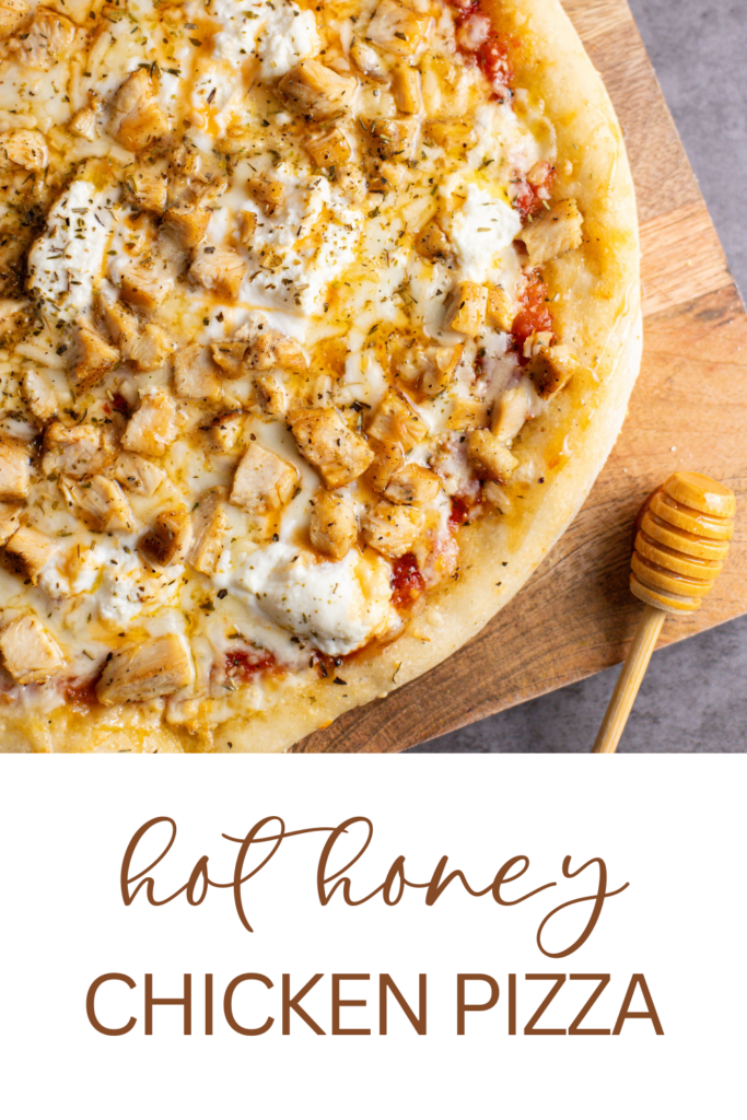 chicken hot honey pizza on cutting board with honey wand