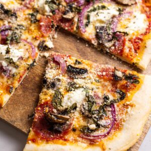 photo of pepperoni mushroom pizza recipe with pizza on cutting board