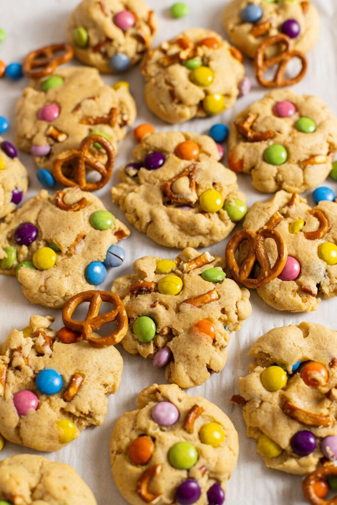 brown butter mm pretzel cookies on a cookie sheet