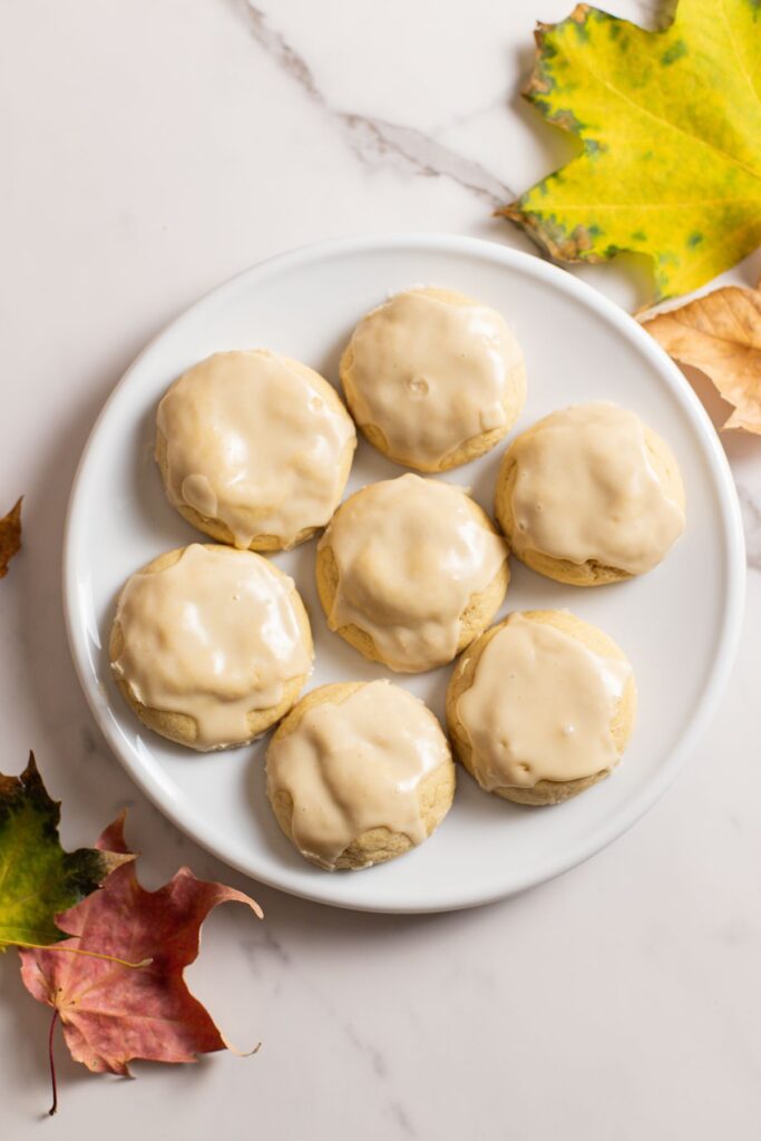 maple cookies sitting on plate with maple leaves