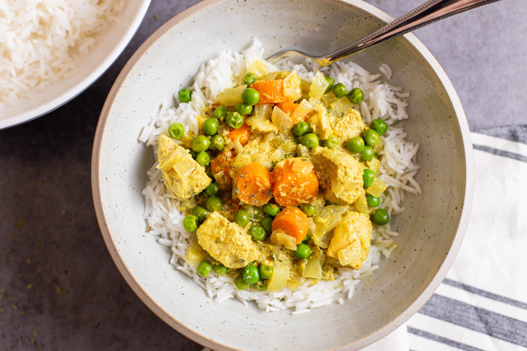 easy slow cooker chicken curry in bowl with rice