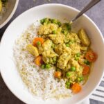 easy slow cooker chicken curry in bowl with rice