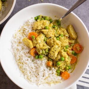 easy slow cooker chicken curry in bowl with rice