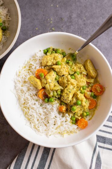 easy slow cooker chicken curry in bowl with rice