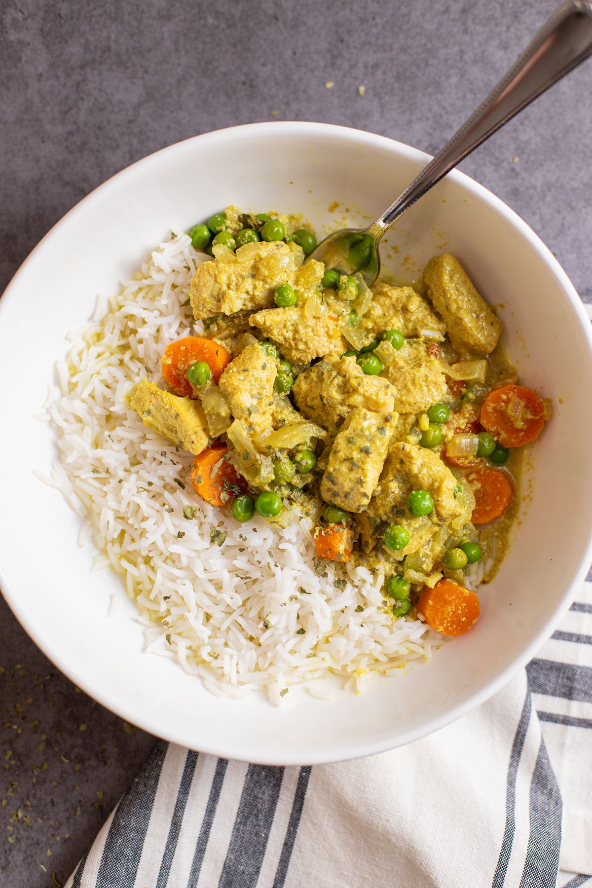 easy slow cooker chicken curry in bowl with rice