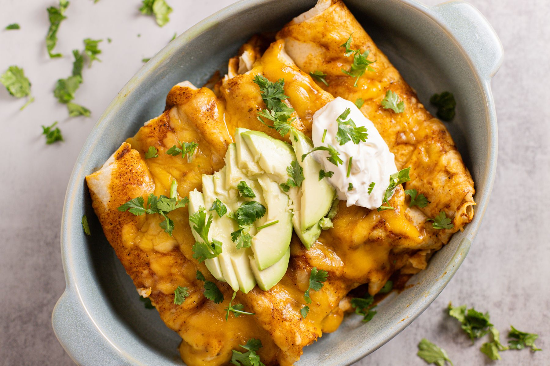 slow cooker chicken enchiladas with sour cream and avocado