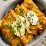 slow cooker chicken enchiladas with sour cream and avocado