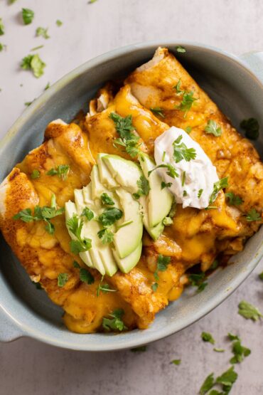 slow cooker chicken enchiladas with sour cream and avocado