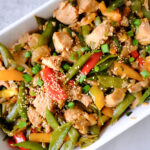 honey chicken stir fry in a baking dish