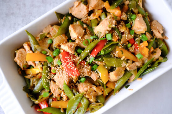 honey chicken stir fry in a baking dish
