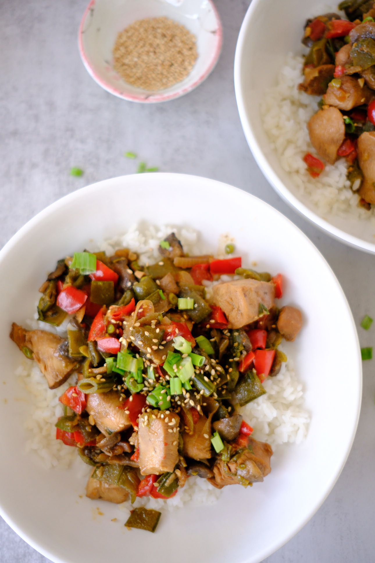 honey stir fry with chicken served over rice in a bowl
