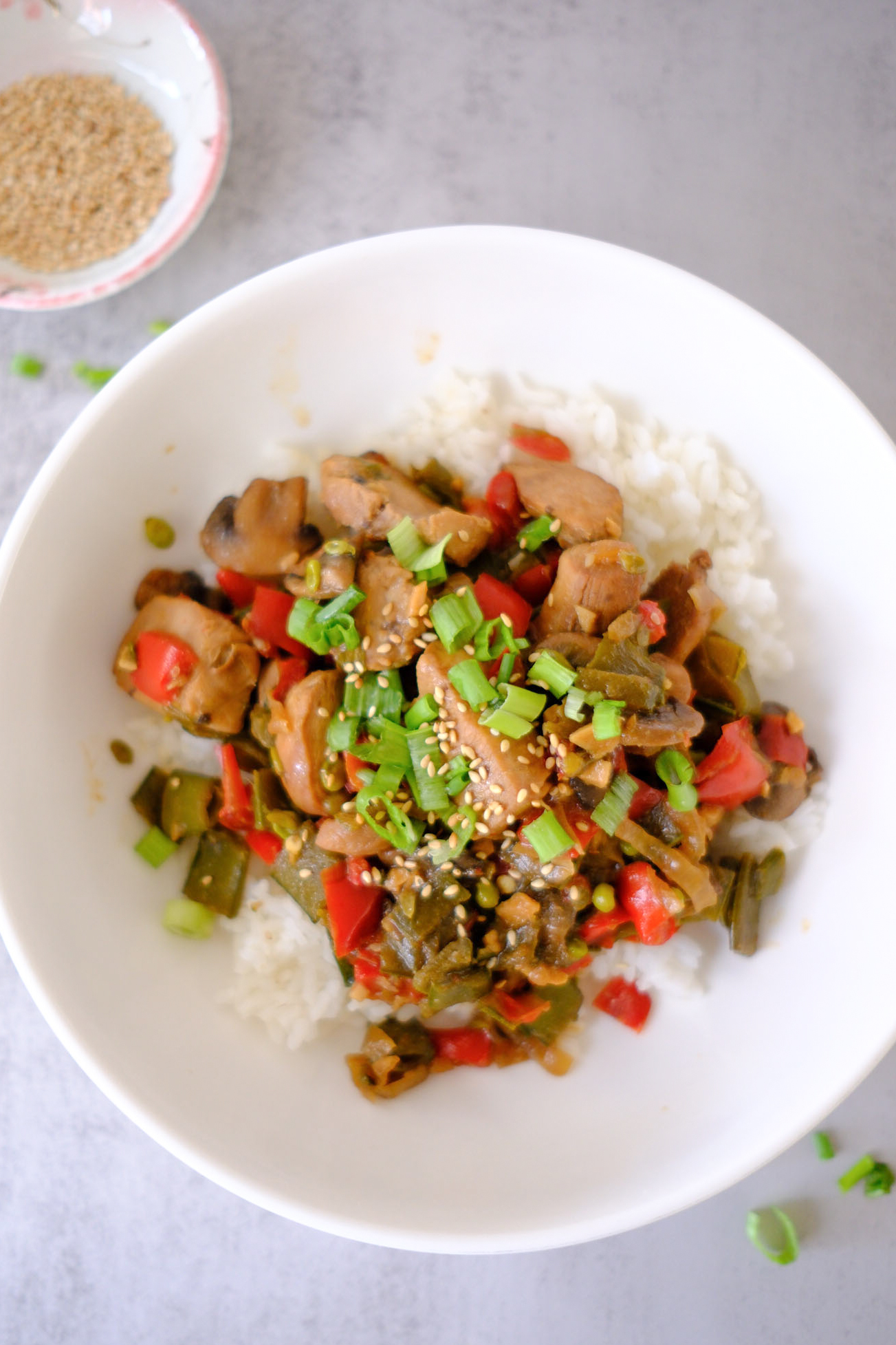 honey soy sauce chicken stir fry on rice in a bowl