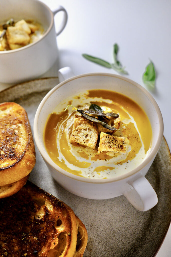 roasted butternut squash soup with garlic​​ in a bowl