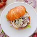 chicken salad sandwich recipe with grapes on a plate