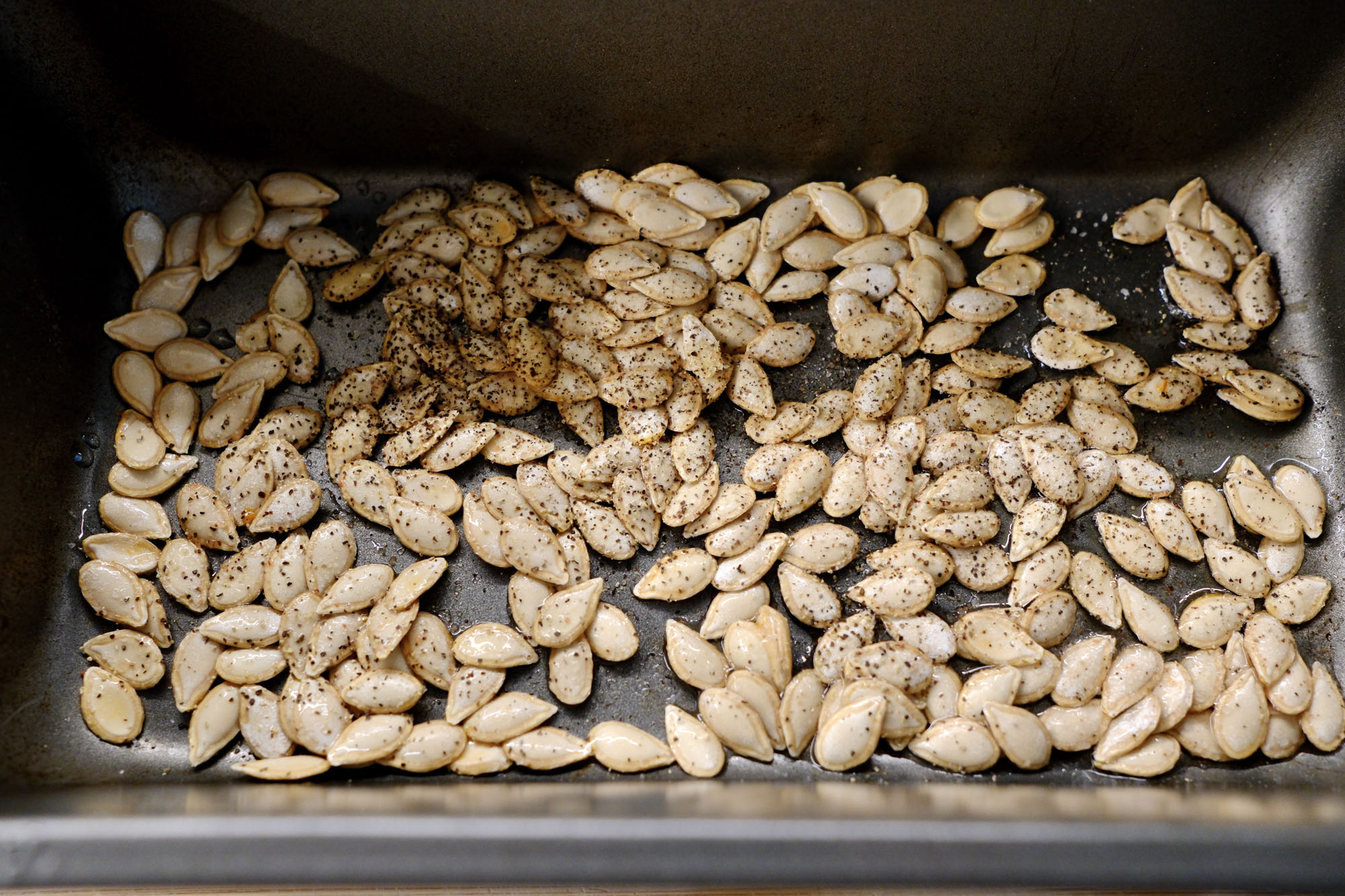 roasted butternut squash seeds on a tray