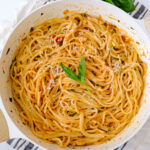 roasted garlic tomato pasta with basil on top