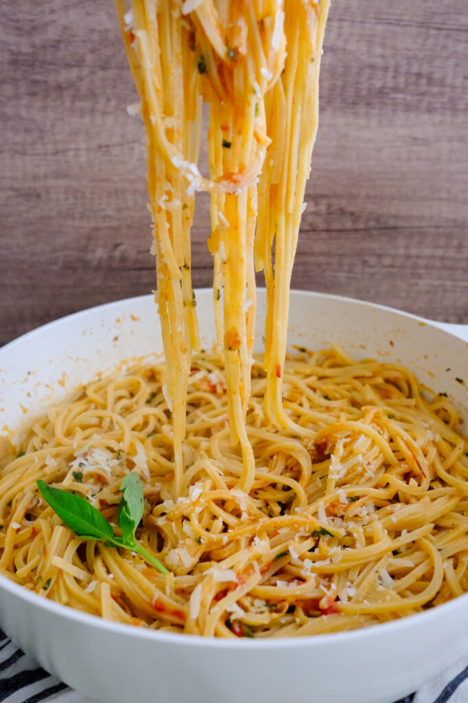 roasted garlic and tomato pasta sauce with noodles pulled