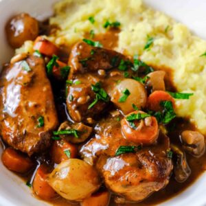 slow cook coq au vin recipe over mashed potatoes