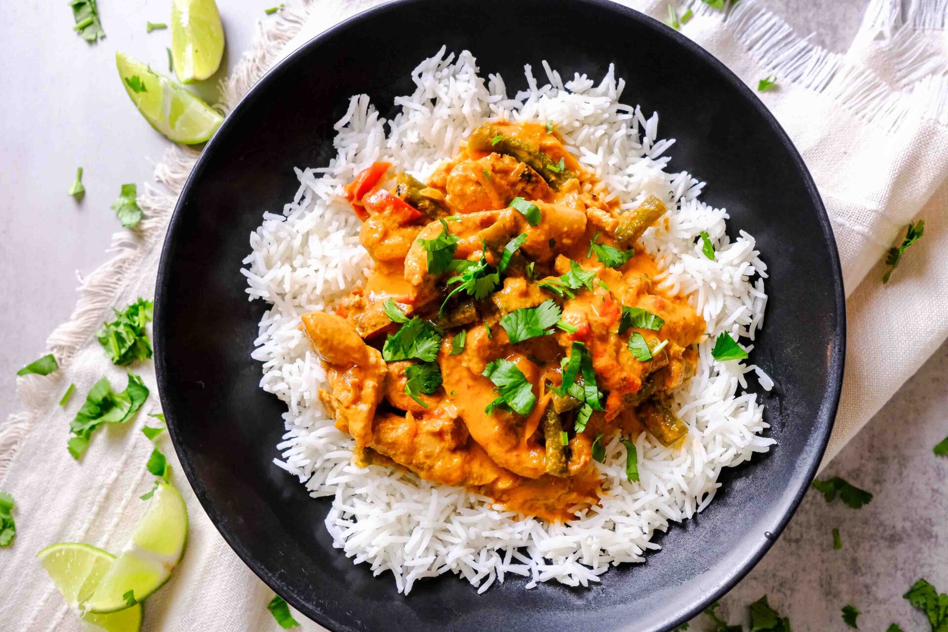red chicken curry slow cooker​ in a bowl