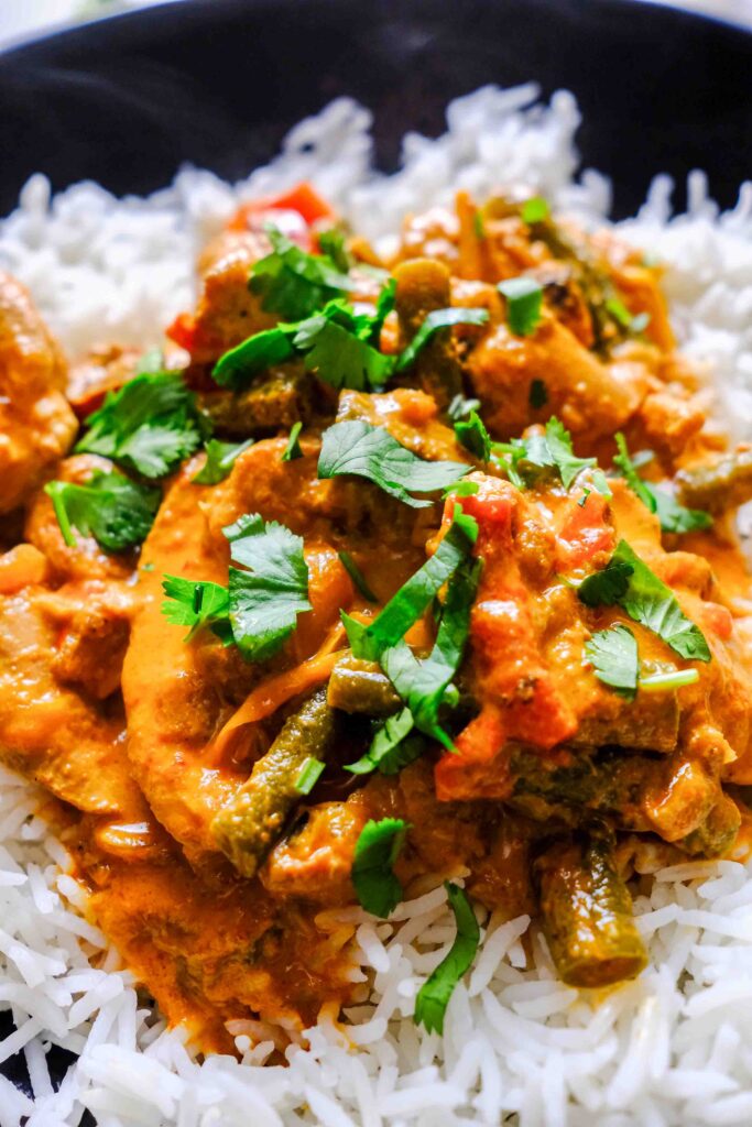 slow cooker red curry chicken in a bowl