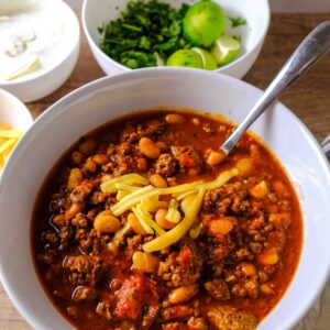 easy crockpot chili recipe in a bowl with toppings